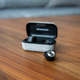 The included charging case is covered in a smooth tweed-like fabric and provides 12 total hours of battery life.
